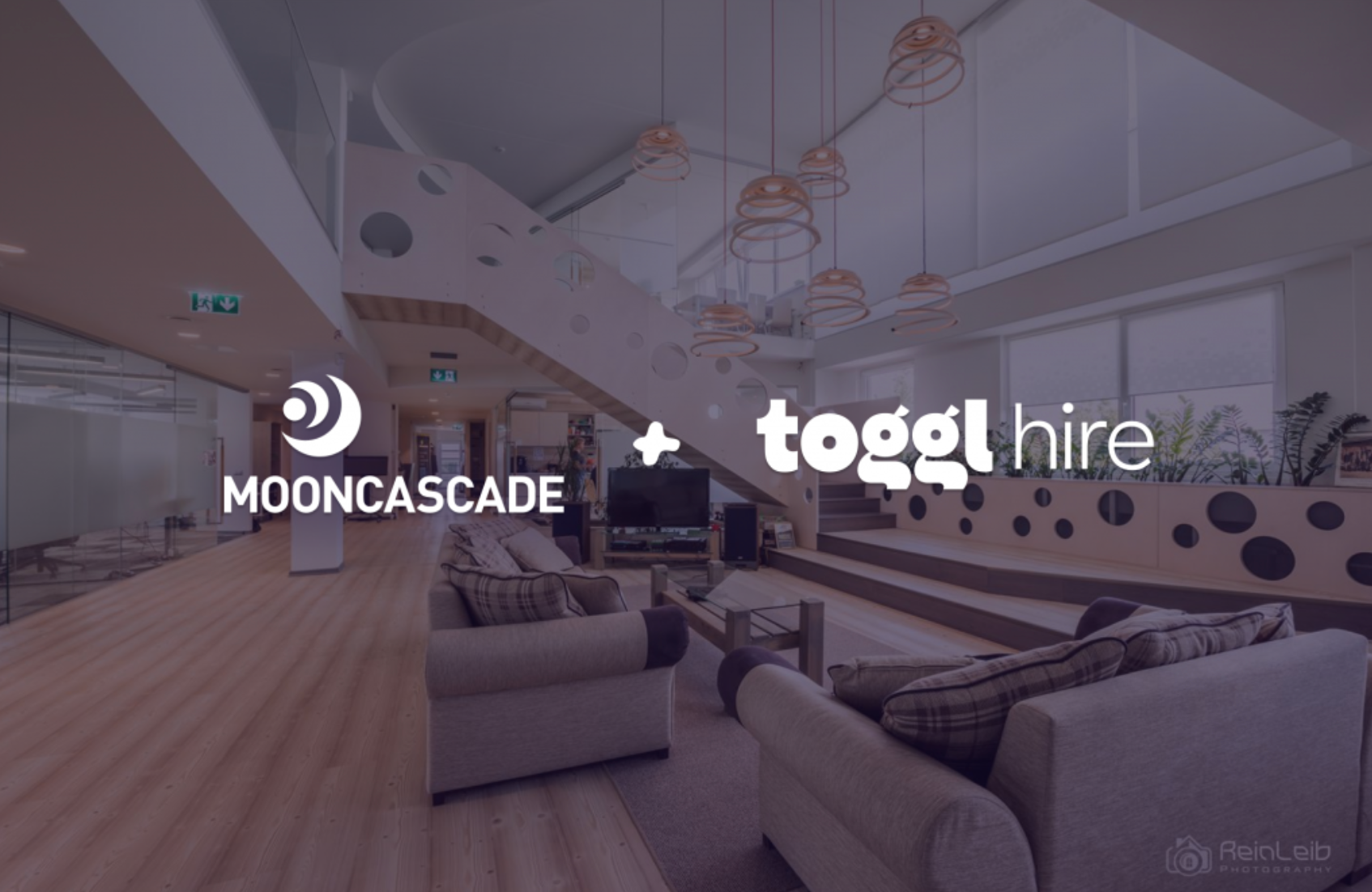 Mooncascade and toggl hire logos overlayed on image of big lounge